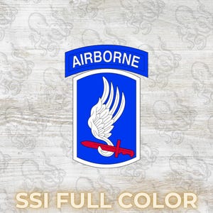 May include: A blue and white Airborne patch with a red dagger and white wings. The word "AIRBORNE" is in white letters on a blue banner. The text "SSI FULL COLOR" is at the bottom.