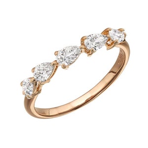 May include: A rose gold band ring with five pear-shaped diamonds set in a row.