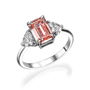 14K Gold Ring with lab Pink Diamond and Heart-Shaped Side Diamonds.