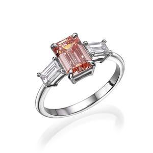 Luxurious 14K Gold Ring with Lab-Created Pink Diamond and Emerald-Cut Side Diamonds