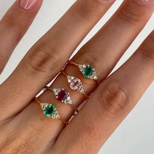 Oval cut gemstone engagement ring with natural diamonds