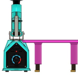 May include: A turquoise and black heat press with a pink platform and two adjustable legs. The heat press has a temperature control knob and a red light indicator. The text "RAYDEN" is printed on the front of the heat press.