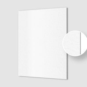 May include: A white textured sheet of paper with a subtle grain. The paper is shown in a close-up view with a small circle highlighting the texture.
