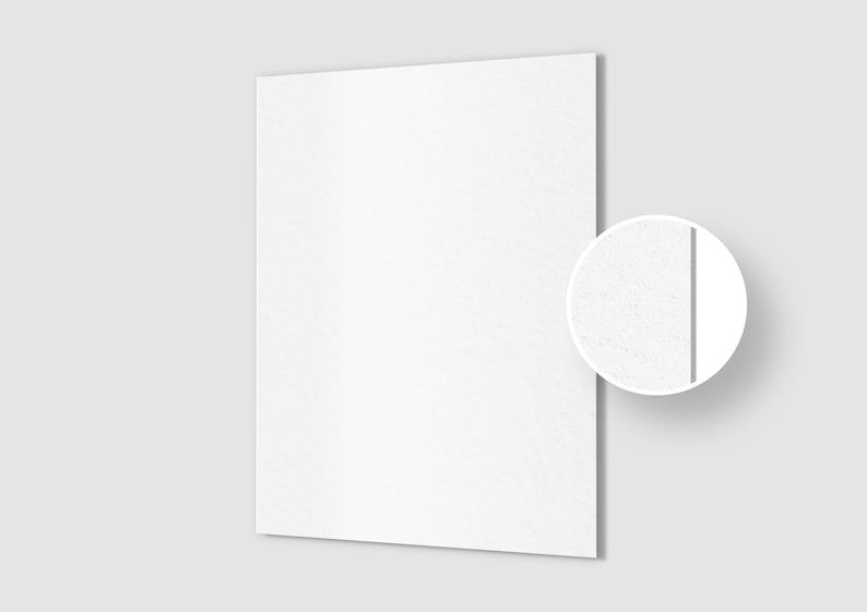 May include: A white textured sheet of paper with a subtle grain. The paper is shown in a close-up view with a small circle highlighting the texture.