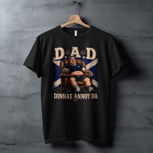 Black t-shirt with "D.A.D DINNAE ANNOY ME" text and Scottish flag.