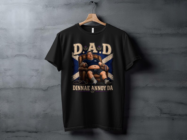 Black t-shirt with "D.A.D DINNAE ANNOY ME" text and Scottish flag.