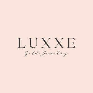 May include: A logo for a jewelry company called "Luxxe Gold Jewelry". The logo is in a minimalist style with the word "Luxxe" in all caps and the words "Gold Jewelry" in a cursive font.
