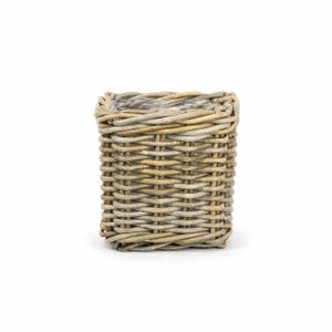 May include: A square-shaped basket woven from light brown and grey natural reeds. The basket features a tight, horizontal weave pattern and includes a clear plastic liner visible at the top opening, providing a structured and functional container.