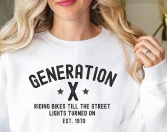 May include: White sweatshirt with black text that reads "GENERATION *X* RIDING BIKES TILL THE STREET LIGHTS TURNED ON EST. 1970"