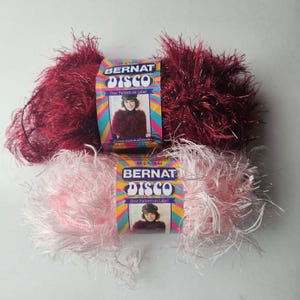 Bernat Disco Yarn, Burgundy Beat, acetate polyester, 50 grams, long eyelash with glitter, discontinued. DUTY & TARIFF in shipping