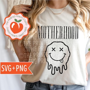 May include: White t-shirt with the text "MOTHERHOOD" and a black dripping smiley face with X's for eyes. The text "CHEEKY PRINTS - SWEET VIBES" is on a peach-colored circle.