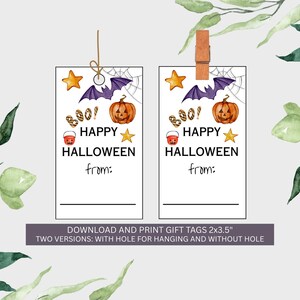 May include: Two printable Halloween gift tags with a pumpkin, bat, and star design. The tags read "Happy Halloween" and have space to write "from:". One tag is attached with twine, the other with a wooden clip. The tags are 2x3.5 inches.