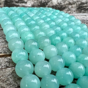 amazonite beads strands stacked on a trunk