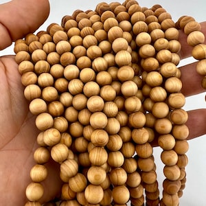 wood beads strand held in hand