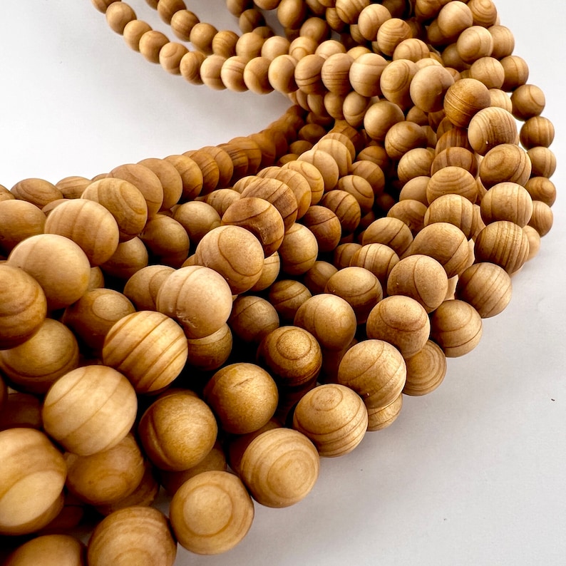 sandelwood loose beads strand on white background