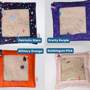 May include: Four square sensory pouches with clear vinyl windows filled with beige filler and small colorful trinkets. The fabric borders are navy with stars, solid purple, glittery orange, and light pink with a subtle white dot pattern.