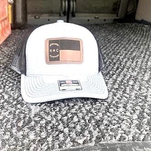NC Flag Richardson Trucker Hat: Engraved Leather Patch