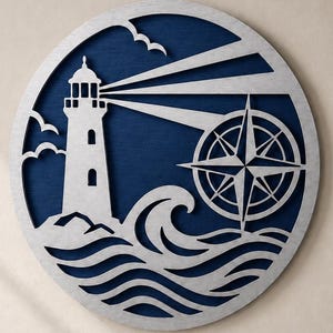 May include: A circular wall art piece featuring a layered design with a silver-toned lighthouse, a compass rose, and stylised ocean waves set against a deep navy blue background. The lighthouse emits two beams of light across the circular frame.