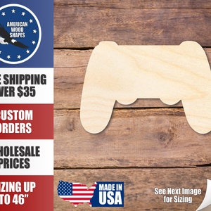 May include: A wooden cutout of a video game controller. The cutout is made of unfinished wood and is ready to be painted or stained. The cutout is approximately 6 inches wide and 4 inches tall.