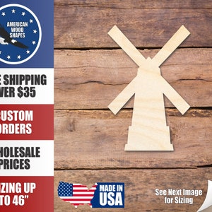 May include: A wooden cutout of a windmill, painted in a light wood color. The cutout is on a brown wooden background. The text "See Next Image for Sizing" is visible in the bottom right corner of the image.