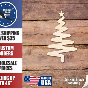 May include: A wooden Christmas tree cutout with a star on top. The tree has a wavy design and is made of light-colored wood. The image also includes text: "American Wood Shapes", "Custom Orders", "Wholesale Prices", and "Made in USA".