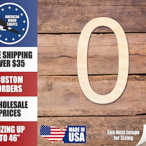 Könnte beinhalten: Ein Holzausschnitt der Zahl Null, weiß lackiert, vor einem Holzmaserungshintergrund. Die Zahl ist etwa 30 cm hoch. Das Bild enthält auch den Text "Made in USA" und "Nächstes Bild für die Größenangabe ansehen".
