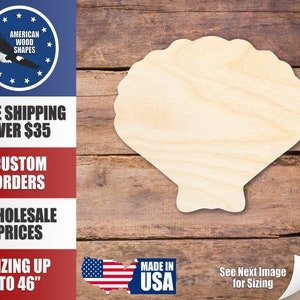 May include: A wooden seashell cutout, unfinished and ready to be painted or stained. The seashell is on a brown wooden background.  The image also includes text that says "Made in USA" and "See Next Image for Sizing".