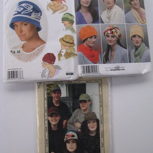 May include: Three sewing pattern envelopes from Simplicity, labeled 1736A, 2494, and Just Friends. The envelopes display various hat designs, including cloches, beanies, and caps, with illustrations and photographs of people wearing the headwear.