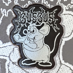 May include: Black and white embroidered patch of a cartoon mouse with an angry expression. The mouse is standing on its hind legs with its fists clenched. The text "DISGUSTING" is above the mouse in a stylized font.