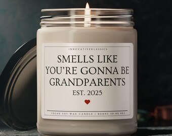 May include: A white soy wax candle with a label that reads "Smells Like You're Gonna Be Grandparents Est. 2025". The candle is in a clear glass jar with a black lid.