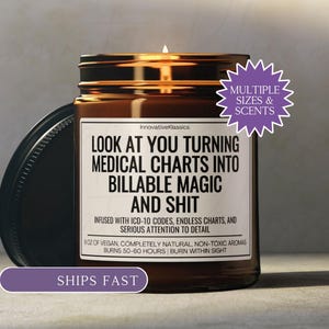 May include: A lit brown glass candle jar with a black lid. The label reads "LOOK AT YOU TURNING MEDICAL CHARTS INTO BILLABLE MAGIC AND SHIT." The candle is 9 oz and burns for 50-60 hours. The text "MULTIPLE SIZES & SCENTS" is also visible.
