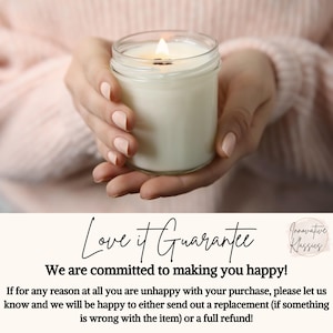 May include: A lit white candle in a clear glass jar. The candle is held by a person with light pink nail polish. The text "Love it Guarantee" is visible at the bottom of the image.