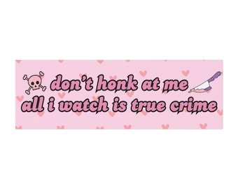 May include: Pink and white sticker with a skull and crossbones, a knife, and the text "don't honk at me all i watch is true crime".