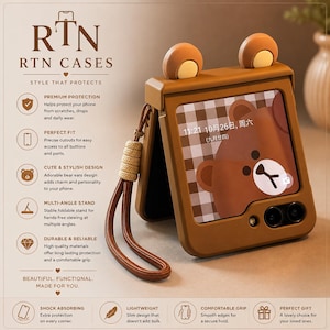 May include: A brown foldable phone case featuring two rounded bear ears on the top edge and a matching brown wrist strap. The case displays a screen with a brown bear graphic, a checkered background, and the date 11:21 10月26日, 周六 (九月廿四).