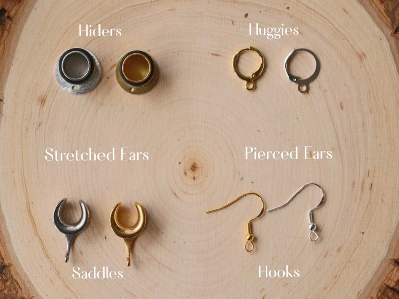 May include: Assortment of earring findings for stretched and pierced ears.  The findings are made of silver and gold metal.  The findings include:  hiders, huggies, saddles, and hooks.
