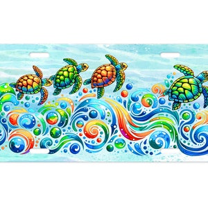 May include: A colorful watercolor illustration of four sea turtles swimming through a wave with swirls of blue, green, orange, and red. The turtles are green, blue, and orange with black eyes.