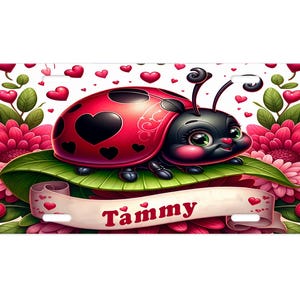 May include: A red and black ladybug with a heart design on its shell sits on a green leaf surrounded by pink flowers. The ladybug has big, black eyes and a cute expression. A white banner with the name "Tammy" is below the ladybug.