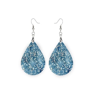 wood teardrop shaped earrings with a high quality printed digital image white vines on a demin blue background