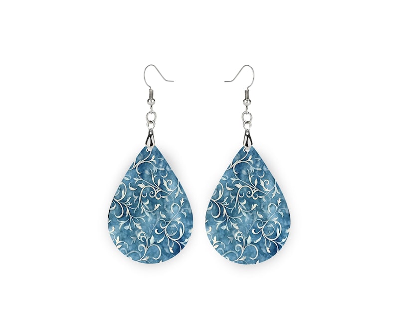 wood teardrop shaped earrings with a high quality printed digital image white vines on a demin blue background