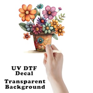 May include: A colorful floral arrangement in a decorative pot, featuring orange, pink, purple, and blue flowers. The image includes the text "UV DTF Decal Transparent Background."
