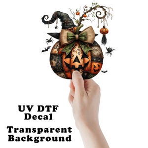 May include: A patchwork pumpkin with a witch's hat, bow, and spider web details. The pumpkin has a jack-o'-lantern face and is surrounded by bats and spiders.  UV DTF Decal. Transparent background.