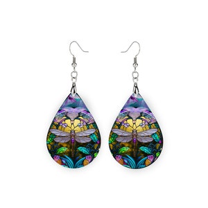 May include: A pair of teardrop-shaped earrings with a stained glass design featuring a dragonfly, flowers, and leaves in shades of blue, green, purple, and gold.