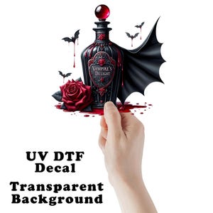 May include: A black bottle with a red lid and a red rose. The bottle has a label that says "Vampire's Delight". There are black bats and red dripping blood around the bottle. The bottle is on a white background.