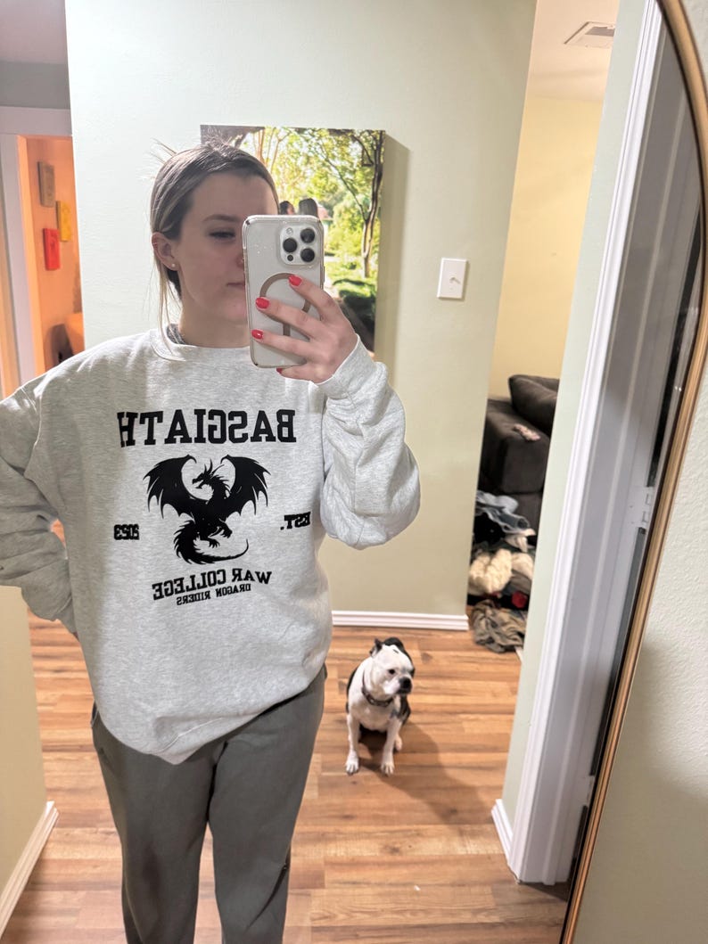 May include: A gray sweatshirt with a black dragon graphic and the text "Dragon Riders War College Est. 2019 Basgiath".
