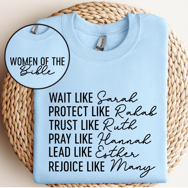 May include: Light blue sweatshirt with black text that reads "Women of the Bible" and "Wait like Sarah, Protect like Rahab, Trust like Ruth, Pray like Hannah, Lead like Esther, Rejoice like Mary."