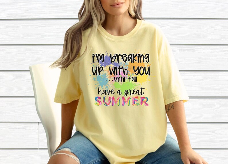 May include: A yellow t-shirt with a colorful graphic that says "I'm breaking up with you...until fall have a great summer".