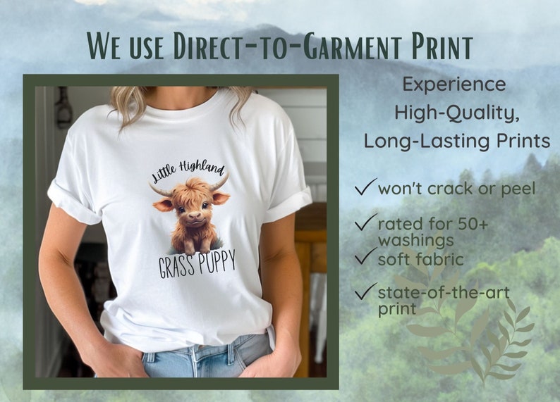May include: White t-shirt featuring a graphic of a brown and white Highland cow with the text "Little Highland" and "Grass Puppy".