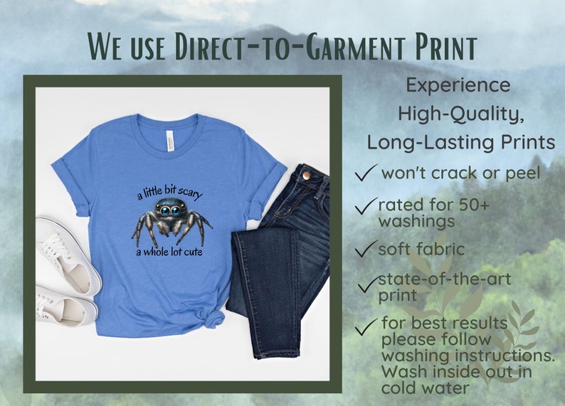 May include: A light blue t-shirt with a graphic of a jumping spider and the text "a little bit scary a whole lot cute." The shirt is paired with dark blue jeans and white sneakers. The image also includes text about the printing process.
