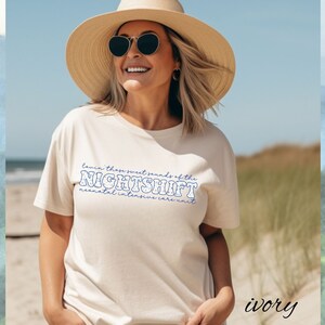 May include: Ivory-colored t-shirt with the text "Lovin' these sweet sounds of the NIGHTSHIFT neonatal intensive care unit" in blue. The person in the image is wearing a straw hat and sunglasses.