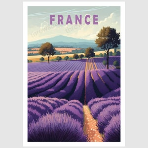 May include: A vintage travel poster featuring a purple lavender field with a dirt path leading through the center. The poster has the word "FRANCE" in large, bold letters at the top.
